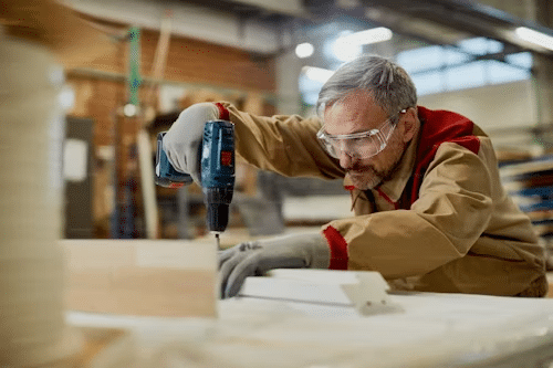 Man with hand tool