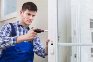 Man fastening a door