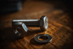 A picture of a bolt, nut and a washer