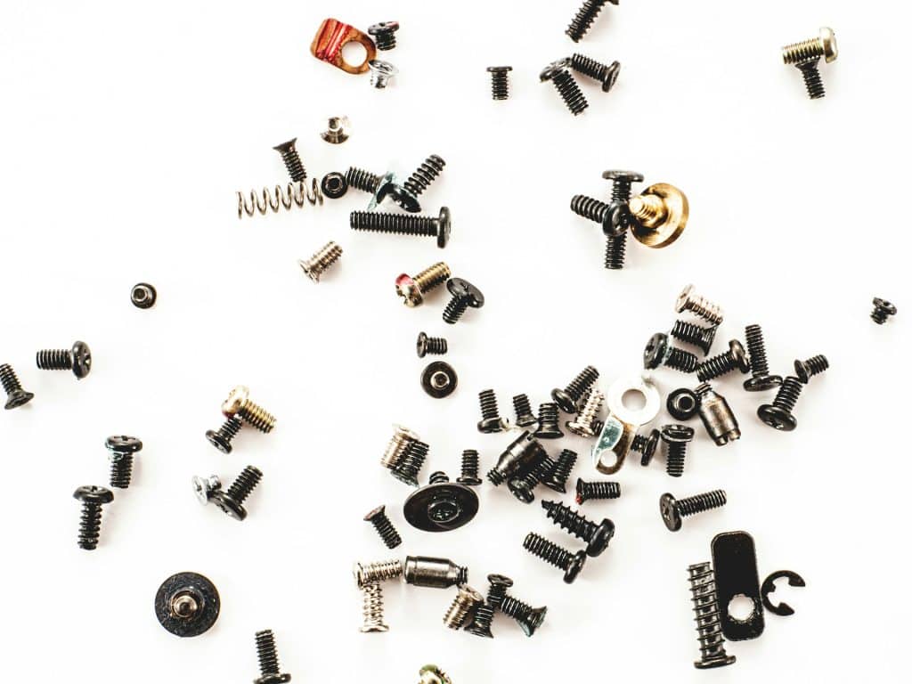 Screws and nuts on a white surface