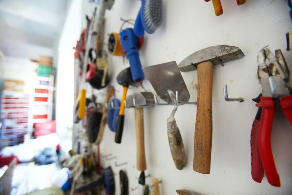 Set of hand tools hanging on the wall