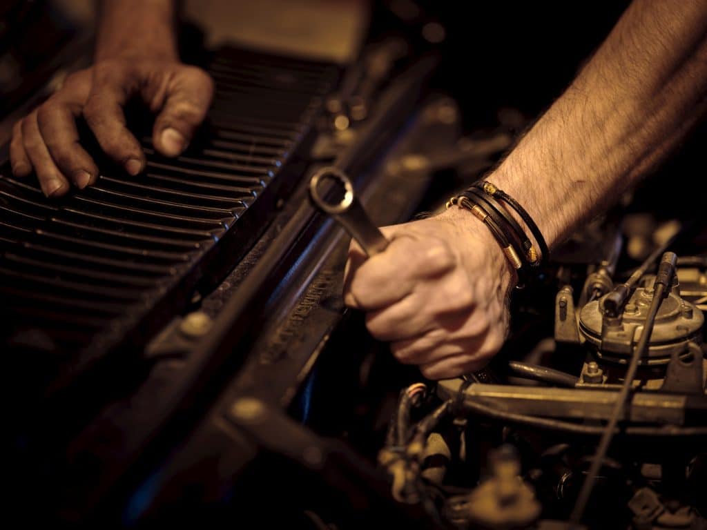 A person holding a hand tool